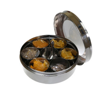 masala dabba, stainless steel spice tin open with lid, contains 7 pots filled with different spices