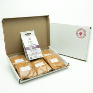 5 sachets 1 Balti Curry Kit displayed in a letter postal box open with a closed box with a handpacked with love sticker
