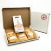 5 sachets 1 Korma Kit displayed in a letter postal box open with a closed box with a handpacked with love sticker